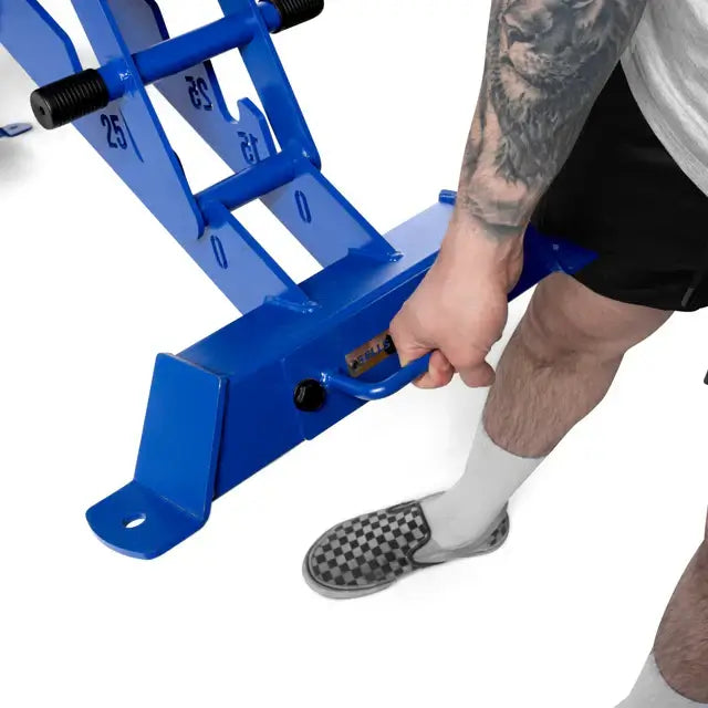 Man adjusting BUZZ-SAW Heavy-Duty Adjustable Bench in home gym.