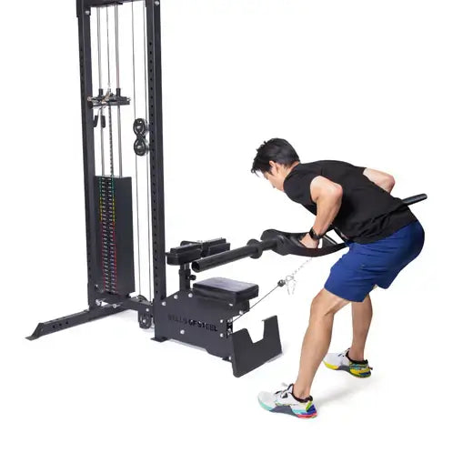 Multi-purpose lat pulldown low row machine used in home gym, fitness equipment Vancouver, space-saving design, man demonstrating workout.