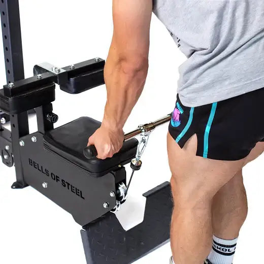 Man using a lat pulldown low row machine at a home gym