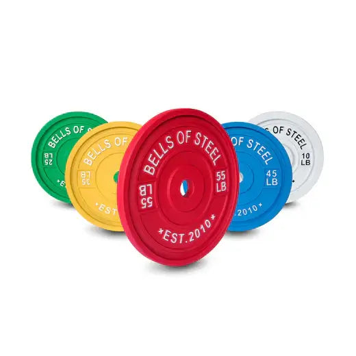 Colorful calibrated powerlifting plates for home gyms, perfect for fitness enthusiasts in Vancouver. Premium quality training equipment.