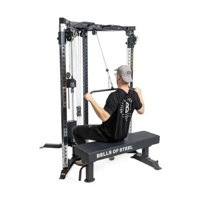 Multi-purpose gym equipment from Bells of Steel with user performing cable workout, ideal for home or commercial gym in Vancouver.