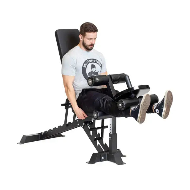 Man using BUZZ-SAW Heavy-Duty Adjustable Bench for leg exercises, fitness equipment Vancouver