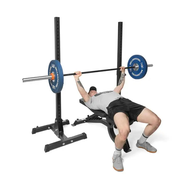 Person using adjustable utility bench with weight bar, promoting fitness equipment for home gyms in Vancouver.