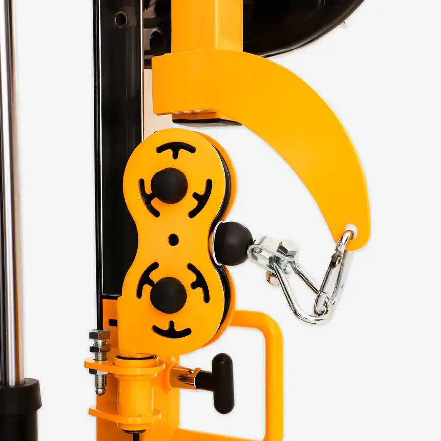 Close-up of the Altas Strength Smith Machine AL-3061B in yellow, showcasing fitness equipment details with a focus on workout components.