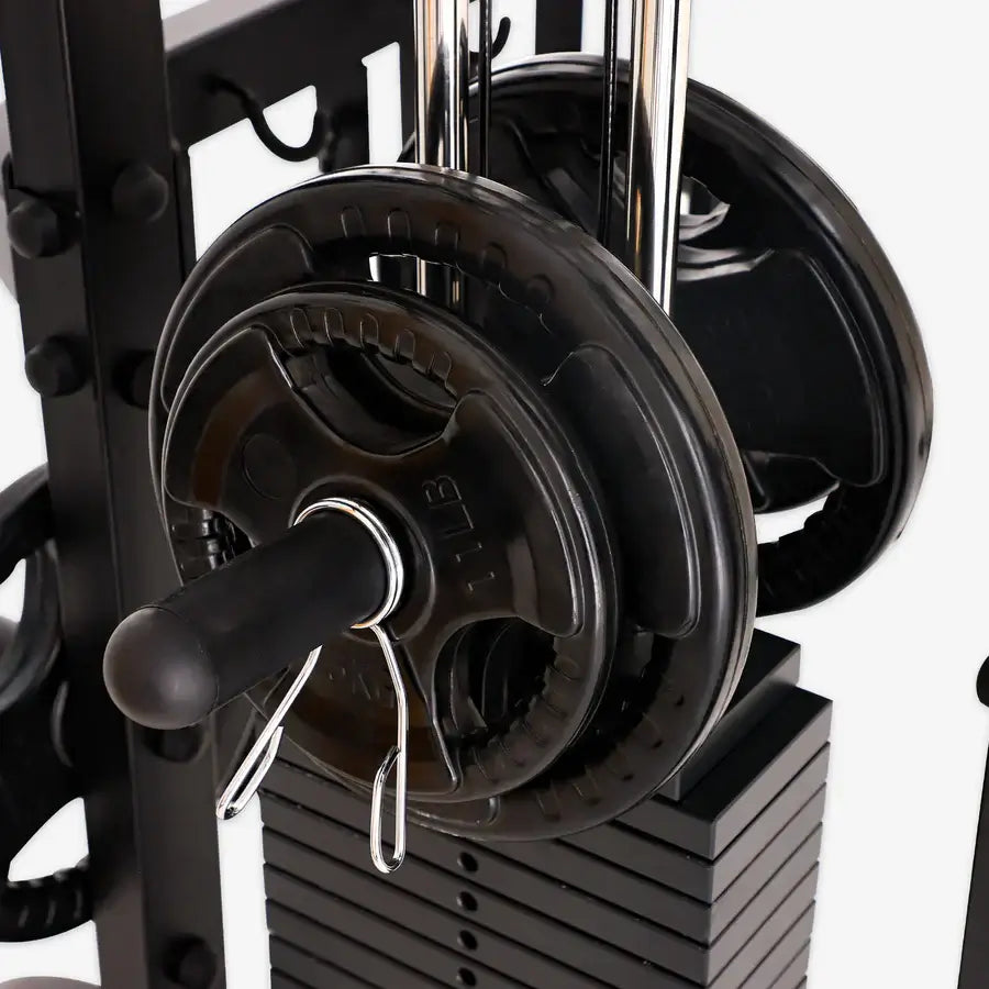 Close-up of ALTAS Strength Smith Machine AL-3061B weight plates, perfect for home gyms in Vancouver.
